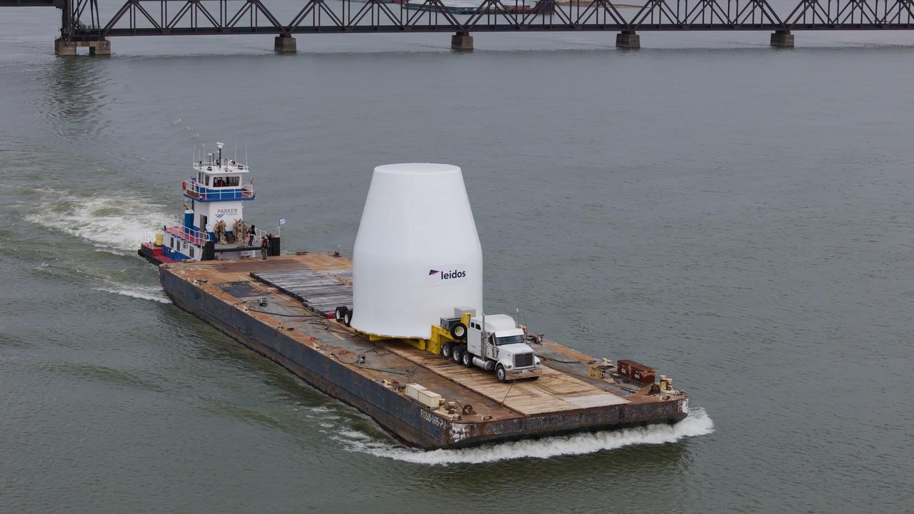 These photos and videos show how crews guided a test version of the universal stage adapter for NASA’s more powerful version of its SLS (Space Launch System) rocket to Building 4619 at the agency’s Marshall Space Flight Center in Huntsville, Alabama, Feb. 22. Built by Leidos, the lead contractor for the universal stage adapter, crews transported the hardware from a Leidos facility in Decatur, Alabama, the same day. The universal stage adapter will connect the SLS rocket’s upgraded in-space propulsion stage, called the exploration upper stage, to NASA’s Orion spacecraft as part of the evolved Block 1B configuration of the SLS rocket. It will also serve as a compartment capable of accommodating large payloads, such as modules or other exploration spacecraft.  In Building 4619’s Load Test Annex High Bay at Marshall, the development test article will first undergo modal testing that will shake the hardware to validate dynamic models. Later, during ultimate load testing, force will be applied vertically and to the sides of the hardware. Unlike the flight hardware, the development test article has flaws intentionally included in its design, which will help engineers verity that the flight adapter can withstand the extreme forces it will face during launch and flight. 